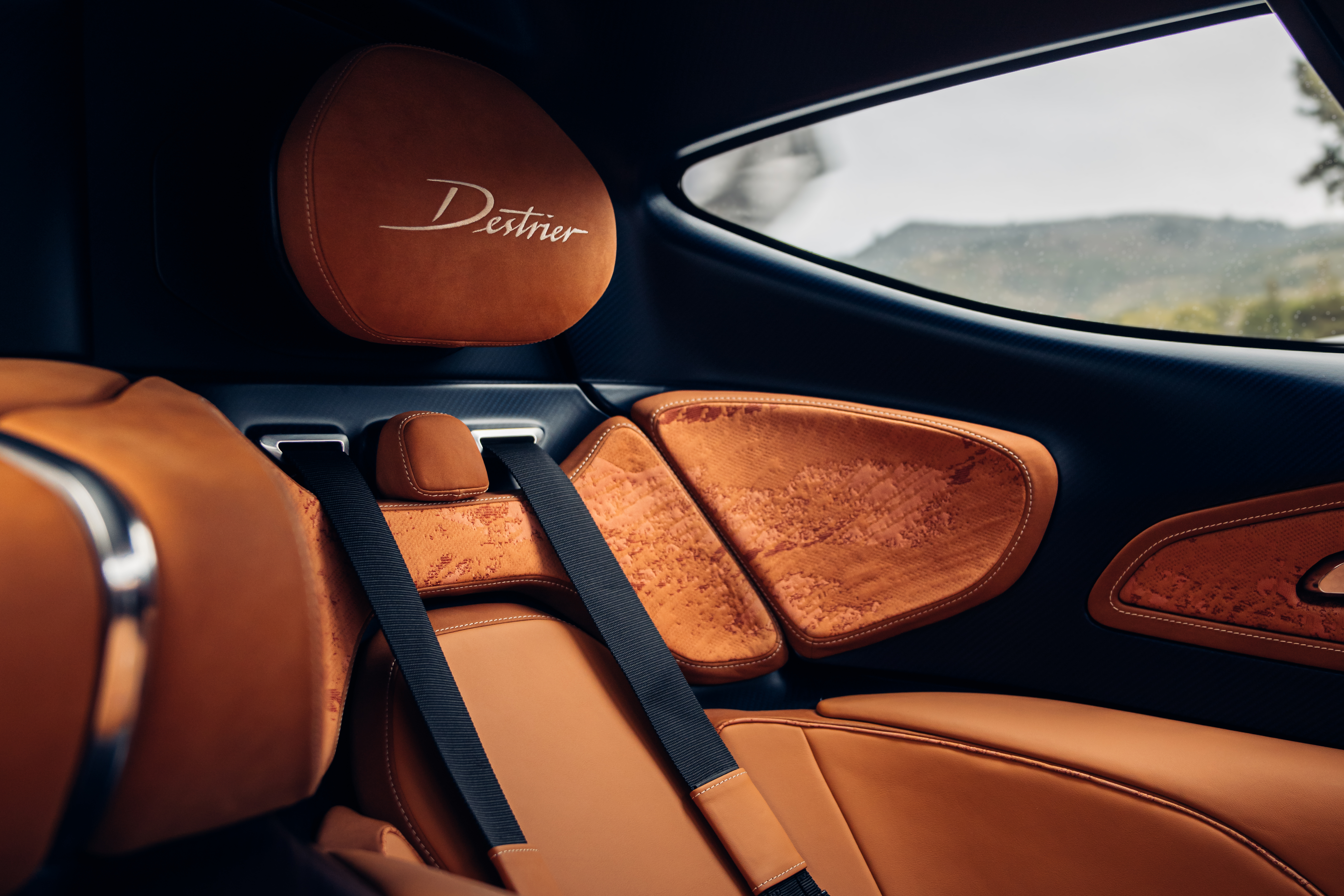 Inside, Destrier moves considerably further from the Bolide's stripped-back, motorsport-focused cockpit, drawing instead on the quiet warmth of a tailor's atelier.